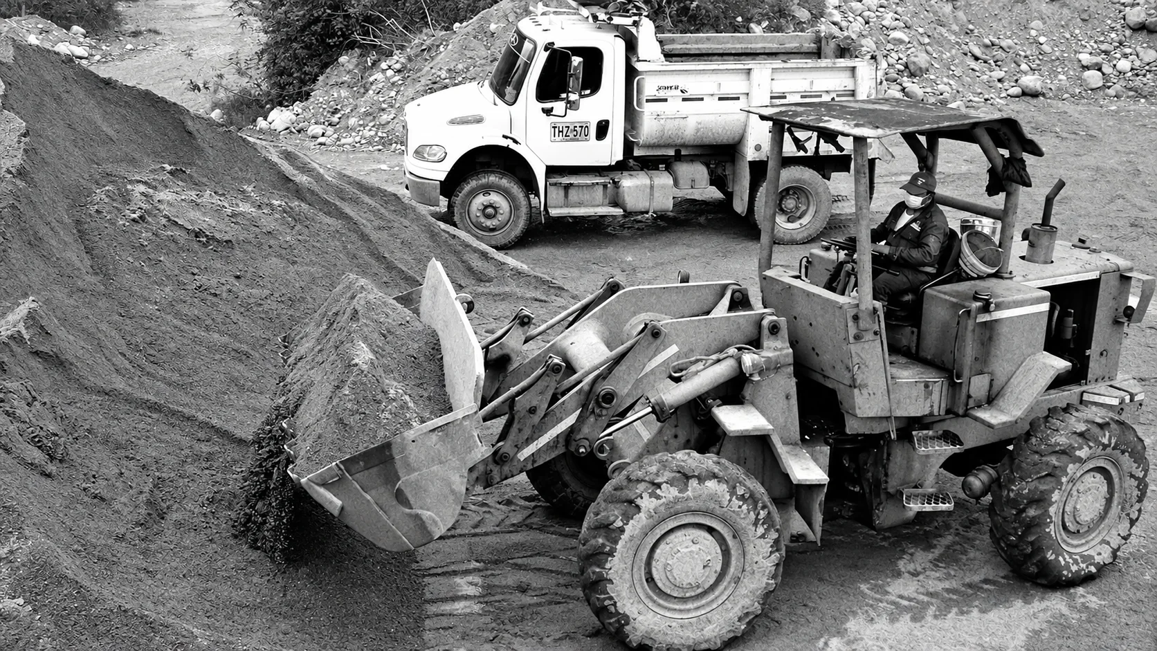 Excavation machinery and trucks at work